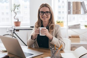 smiling woman on computer